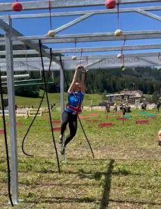 Erika Poole from Team UK completing one of the hanging rigs at the OCR European Championships 2022